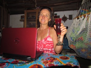 Juanita in Yelapa Mexico toasting the lifestyle of summer in two countries
